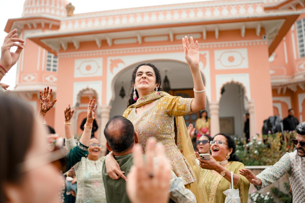 Guests celebrating with dance and joy at a traditional Indian wedding in Jaipur, India.